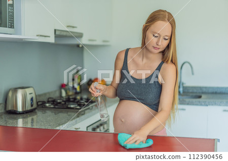 Efficient and dedicated, a pregnant woman tackles kitchen chores, ensuring a clean and organized space, exemplifying resilience and care during her pregnancy Efficient and dedicated, a pregnant woman tackles kitchen chores, ensuring a clean and organized space, exemplifying resilience and care during her pregnancy 112390456