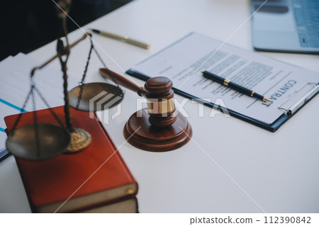 Consultation and conference of Male lawyers and professional businesswoman working and discussion having at law firm in office. Concepts of law, Judge gavel with scales of justice. 112390842