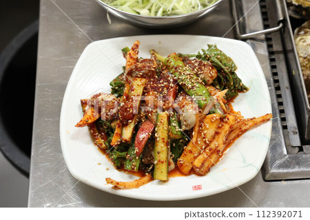 Korea style food. Raw Oyster spicy sauce Salad 112392071