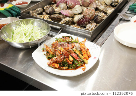 Korea style food. Raw Oyster spicy sauce Salad 112392076