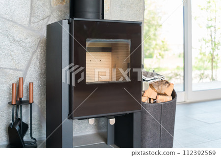 Room with wood stove Room with wood stove 112392569