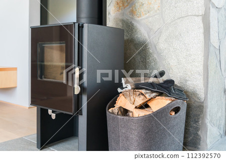 Room with wood stove Room with wood stove 112392570