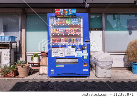 Tokyo, Japan -October  1  , 2023 :  Vending machines in Tokyo, Japan. Coca-Cola vending machine on a residential street 112393971