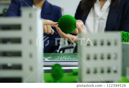 Business tam using tablet for working technology and business,  Renewable energy-based green businesses and global warming. Reduce CO2 emission. 112394526