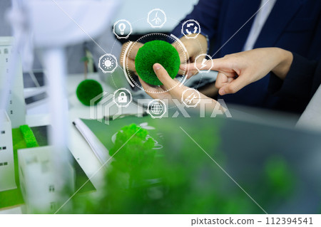 Business tam using tablet for working technology and business,  Renewable energy-based green businesses and global warming. Reduce CO2 emission. 112394541