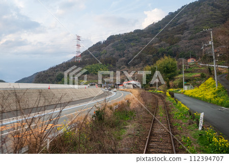 Spring scenery of the local train along the river seen from the train window Spring scenery of the local train along the river seen from the train window 112394707