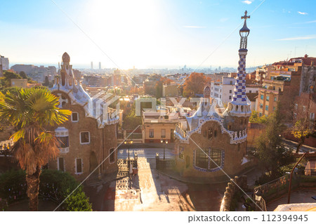 View of fairytale gingerbread houses in Park Guell designed by Antoni Gaudi in Barcelona, Spain View of fairytale gingerbread houses in Park Guell designed by Antoni Gaudi in Barcelona, Spain 112394945