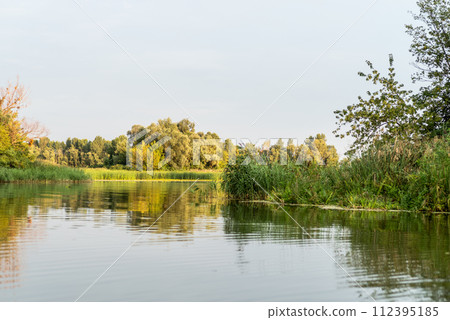 Nature and lake. Natural landscape with trees and lake. Passage from lake to lake. 112395185