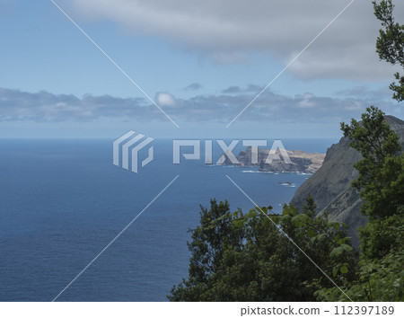 Views from Vereda do Larano coastal hiking trail. Cliffs atlantic ocean and green tropical vegetation. Madeira island, Portugal, Europe. 112397189