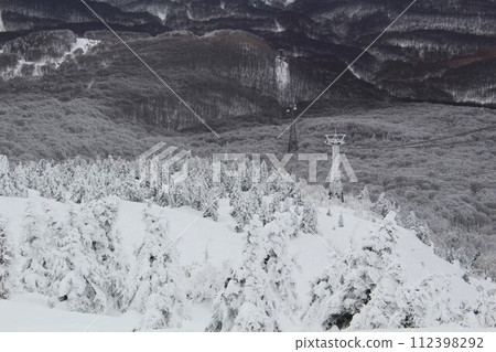 Mt. Hakkoda's frost-covered trees and ropeway tower, Mt. Hakkoda National Park, Aomori Prefecture 112398292