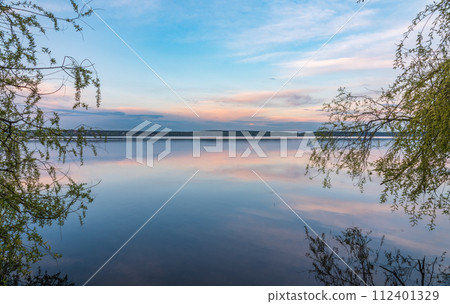 Blue lake with cloudy sky, natural background 112401329