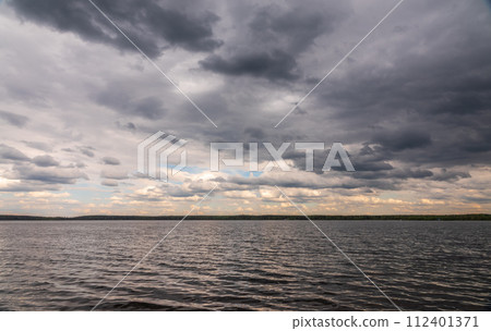 Blue lake with cloudy sky, natural background 112401371