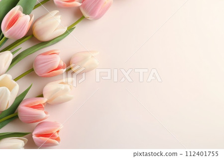 Delicate pink tulips on a soft pastel background, capturing the essence of spring and elegance. Copy space 112401755