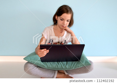 Girl student online learning class study online video call zoom teacher, Happy girl learn english language online with laptop at home. New normal. Social distancing. stay home . High quality photo 112402192