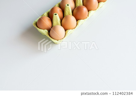 Eggs from egg tray isolated on white background. 112402384