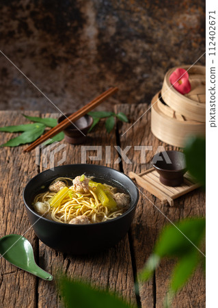 Yellow noodles in clear broth with bitter melon and ground pork 112402671
