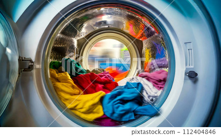 Closeup of a Washing Machine Full of Multicolored Clothes - Generative Ai 112404846