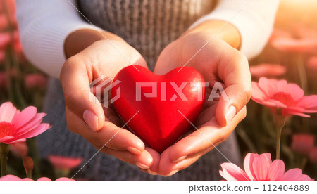Cupped Hands of a Woman Holding a Small Red Heart - Generative Ai 112404889