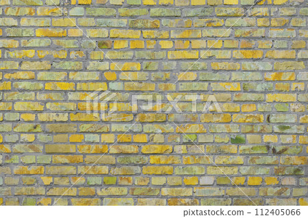 Old yellow painted brick wall texture background 112405066