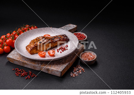 Delicious red salmon fish grilled with sauce and sesame, spices and herbs 112405933