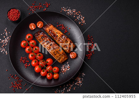 Delicious red salmon fish grilled with sauce and sesame, spices and herbs 112405955