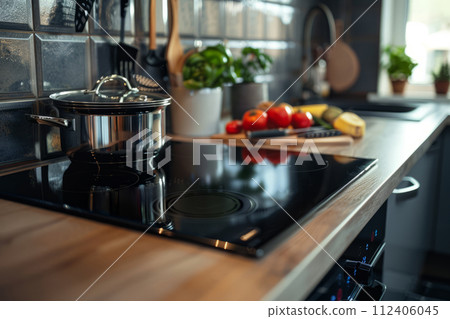 Modern black induction stove in kitchen interior. Contemporary home with modern interior. Generative AI 112406045