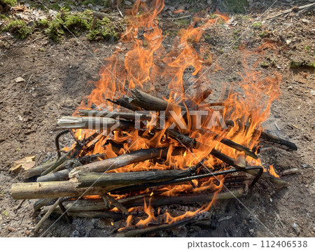 a barbecue campfire is built in the forest 112406538