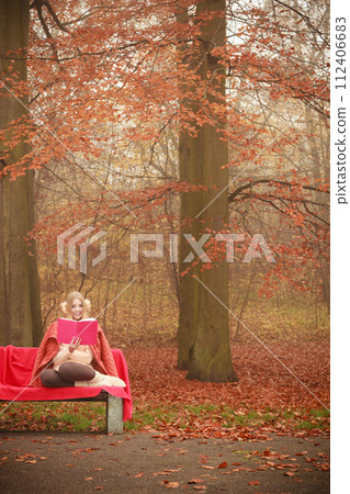 Blonde girl with red book. Blonde girl with red book. 112406683