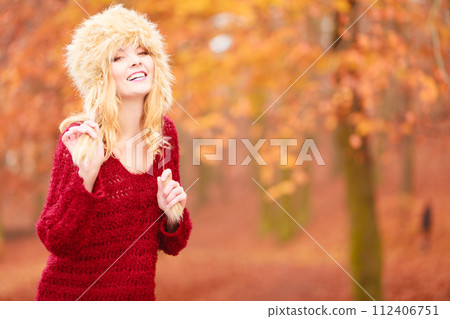 Portrait of pretty smiling woman in fur winter hat Portrait of pretty smiling woman in fur winter hat 112406751