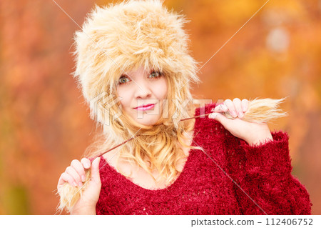 Portrait of pretty fashion woman in fur winter hat Portrait of pretty fashion woman in fur winter hat 112406752