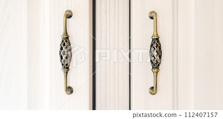 White cabinet with vintage door handles. White cabinet with vintage door handles. 112407157