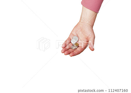 Last money for groceries. Coins in the hand of a middle-aged woman. The concept of the world food crisis associated with the war in Ukraine. Isolated on white background Last money for groceries. Coins in the hand of a middle-aged woman. The concept of the world food crisis associated with the war in Ukraine. Isolated on white background 112407160