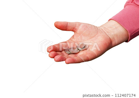 Last money for groceries. Coins in the hand of a middle-aged woman. The concept of the world food crisis associated with the war in Ukraine. Isolated on white background 112407174