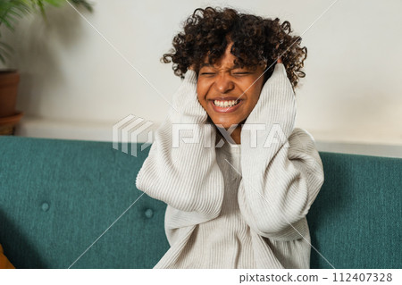Beautiful African American girl with afro hairstyle smiling. Close up portrait of young happy black girl. Young African woman with curly hair laughing. Freedom happiness carefree happy people concept Beautiful African American girl with afro hairstyle smiling. Close up portrait of young happy black girl. Young African woman with curly hair laughing. Freedom happiness carefree happy people concept 112407328
