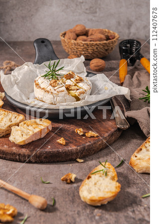 Fresh sliced Camembert cheese 112407678