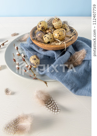 Quail eggs in a ceramic bowl 112407759