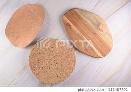 Wooden cutting board on a gray marble background 112407791