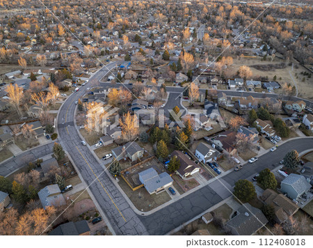 winter morning over a residential street in Fort Collins in northern Colorado, aerial view winter morning over a residential street in Fort Collins in northern Colorado, aerial view 112408018