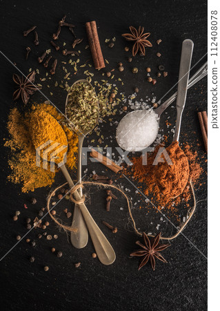 Various spices spoons 112408078