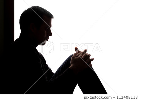 Young man with grief dropped his arms Young man with grief dropped his arms 112408118