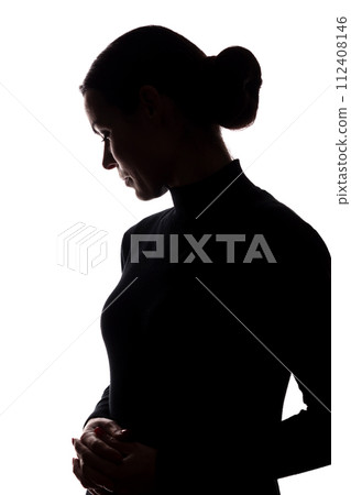 Silhouette of a young woman in sorrow Silhouette of a young woman in sorrow 112408146