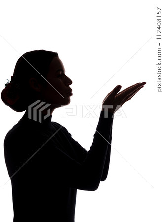 Young woman shows his hands forward, sending a kiss Young woman shows his hands forward, sending a kiss 112408157