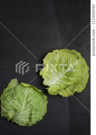 Cabbage leaves background 112408580