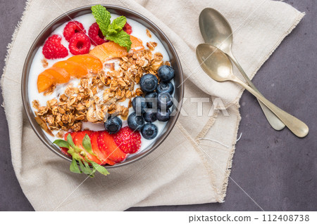 Yogurt with baked granola and berries Yogurt with baked granola and berries 112408738