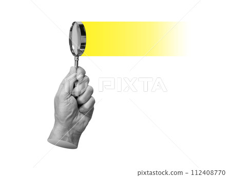 Magnifying glass in hand, searching, focusing on yellow light. Insight, solution and study concept 112408770