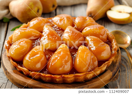 Pear tarte tatin or French fruit tart with gluten free crust. La Tarte Bourdaloue 112409007