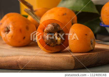 loquats on kitchen counter loquats on kitchen counter 112409148