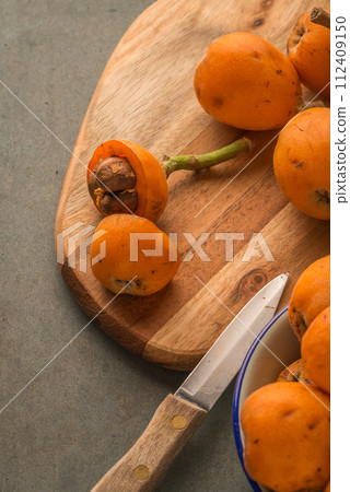 loquats on kitchen counter loquats on kitchen counter 112409150