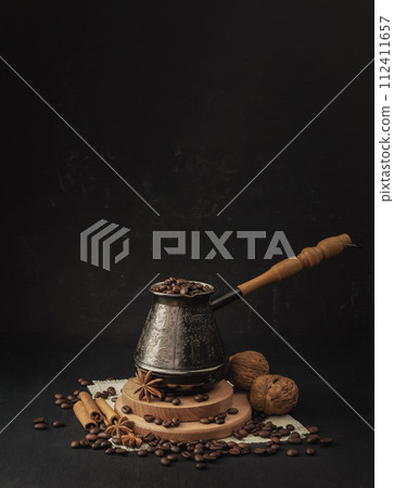 Turkish Jezve Coffee Pot with  coffee beans . Aromatic coffee with spices. Start of the day. 112411657