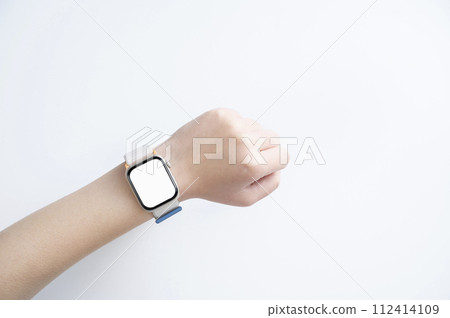 Woman's hand wearing a smartwatch Woman's hand wearing a smartwatch 112414109
